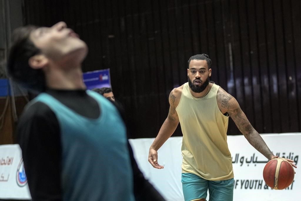 Americans star on an Iraqi basketball team. Its owners include forces that attacked US troops
