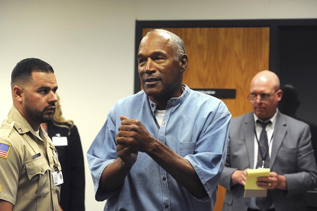 FILE - In this July 20, 2017 file photo, former NFL football star O.J. Simpson reacts after learning he was granted parole at Lovelock Correctional Center in Lovelock, Nev.