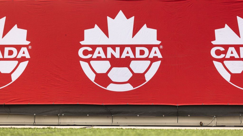 A Soccer Canada logo is displayed on the sideline at Tim Hortons Field in Hamilton