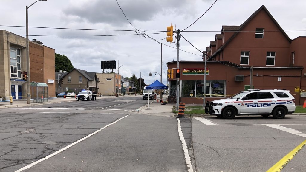 Police investigate a stabbing near near John Street and Simcoe Street South in Oshawa on May 28, 2024