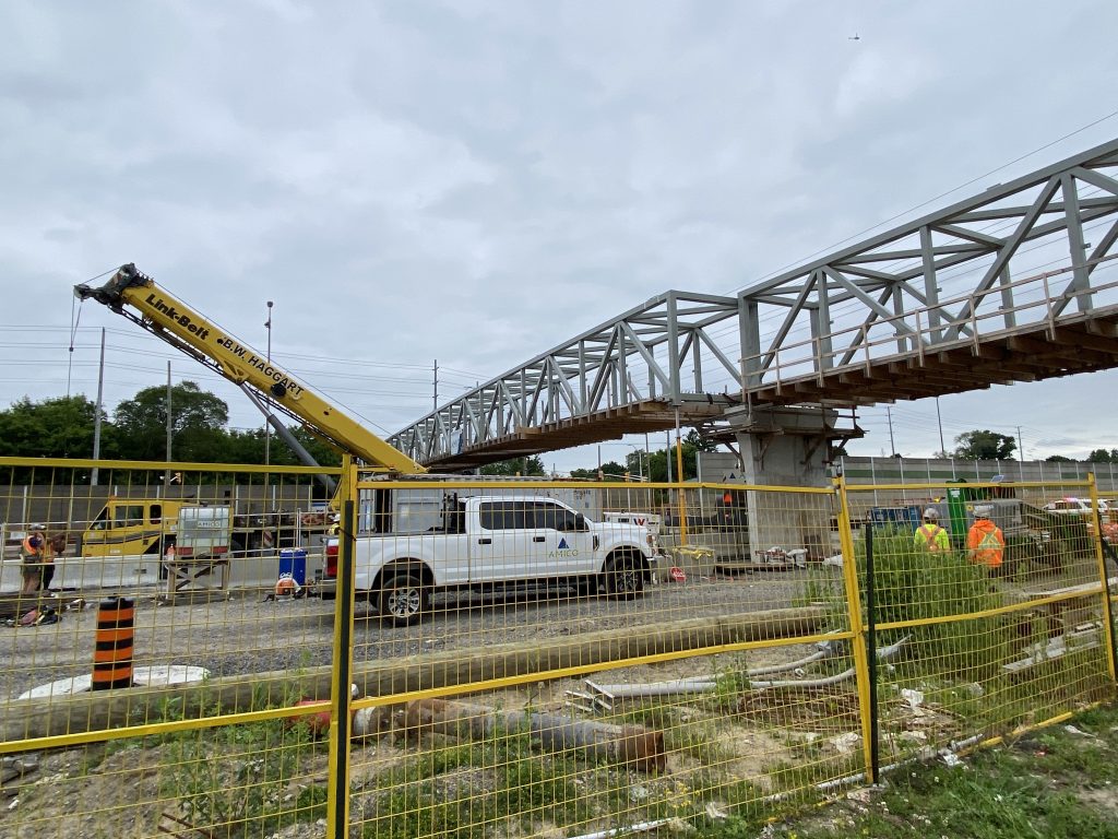 A dump truck hit a pedestrian bridge under construction on North Service Road near the QEW in Mississauga on June 11, 2024