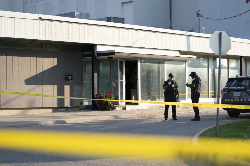 Toronto police officers investigate reports of gunshots, in Toronto, Monday, June 17, 2024.
