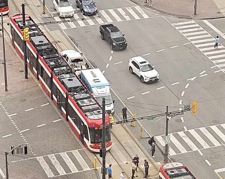 A streetcar has collided with a truck at Queens Quay and York Street on Friday morning.