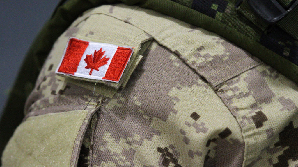 A Canadian flag sits on a members of Canadian forces that are leaving from CFB Trenton, in Trenton, Ont., on October 16, 2014.