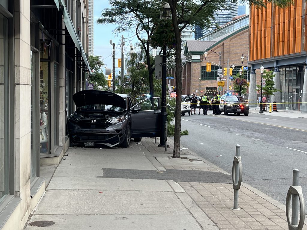 2 injured after vehicle hits tree, pedestrian and storefront in downtown Toronto