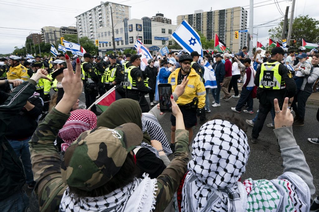 From assaulting an officer to stomping on an Israeli flag, police outline arrests at tense ‘Walk with Israel’ event