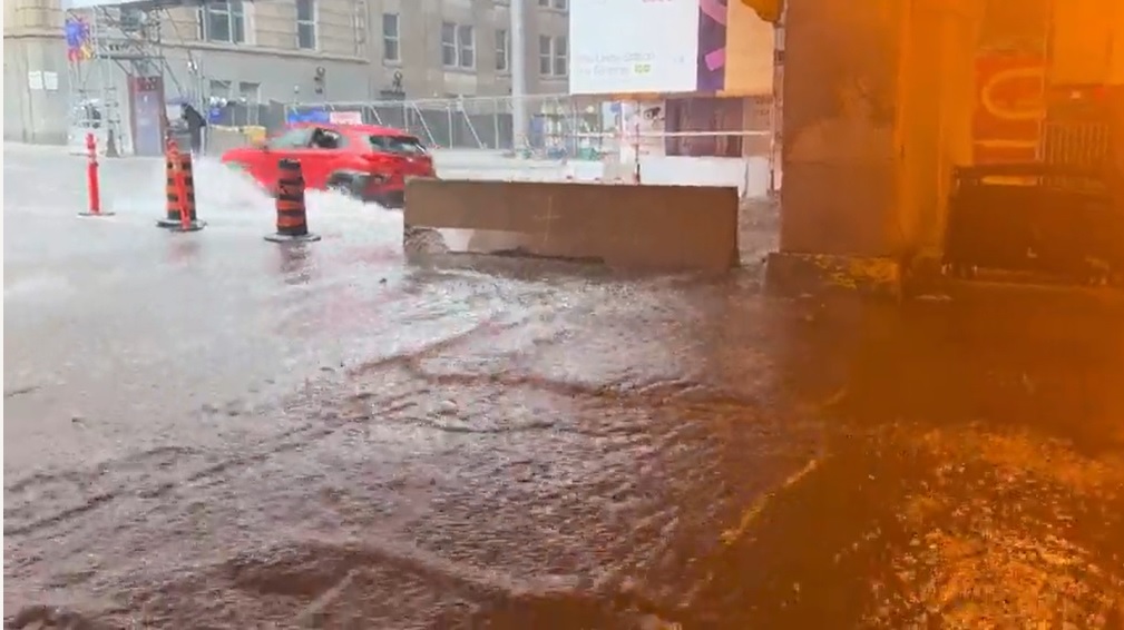 Flooding at Bay and Front streets in Toronto due to heavy rain on July 16, 2024