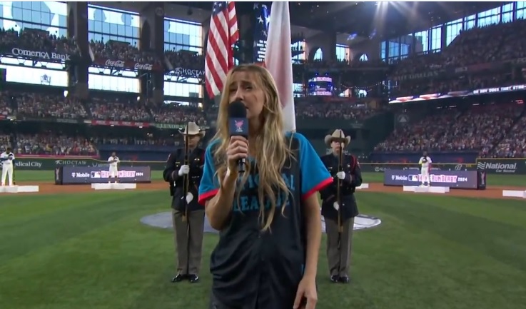 Screengrab of Ingrid Andress singing the National Anthem at Monday night's home run derby in Texas