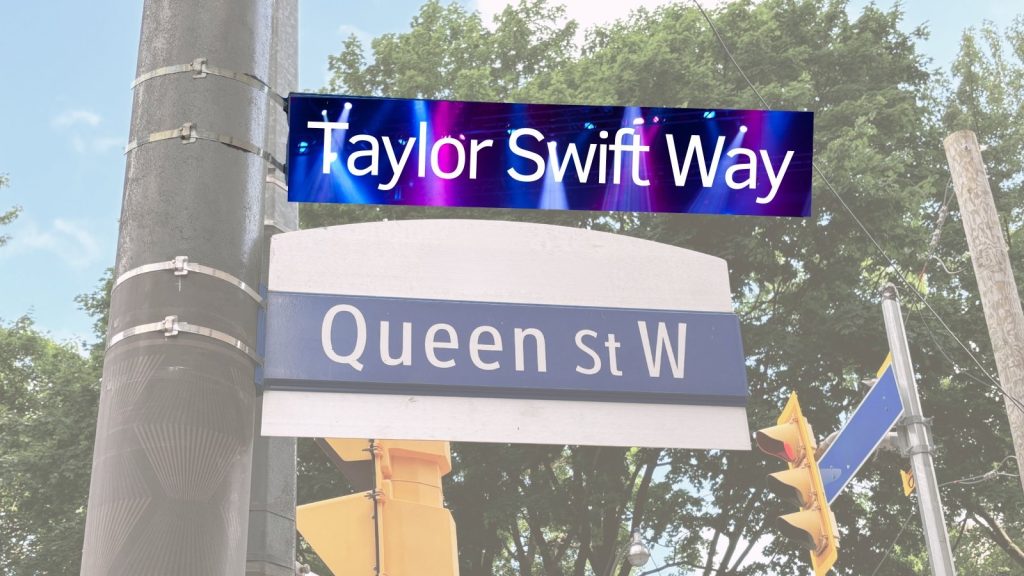 A photo from Deputy Mayor Jennifer McKelvie depicting Queen St. signs being replaced by signs saying, "Taylor Swift Way."