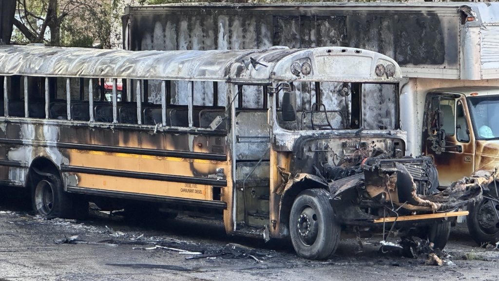 School bus catches fire behind North York grocery store; no injuries