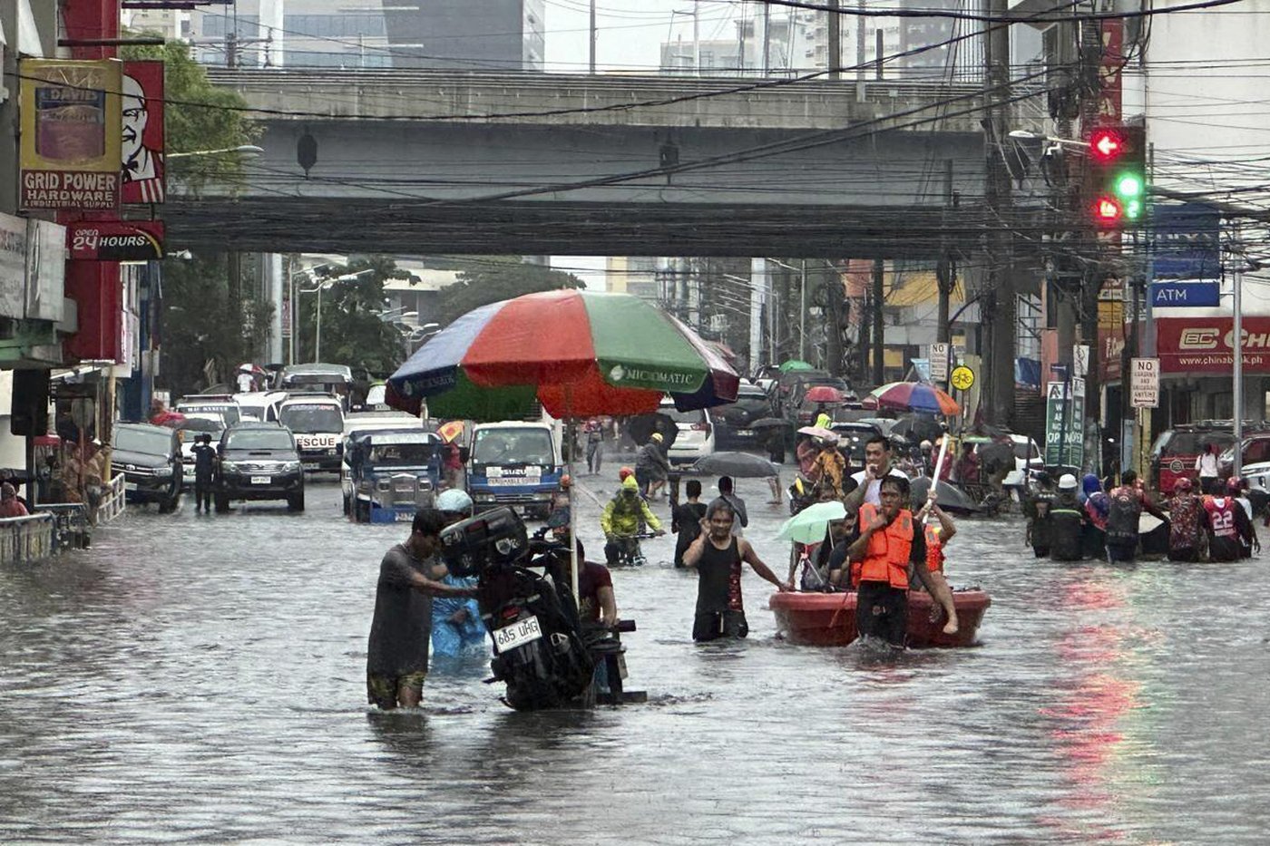 Monsoon rains worsened by offshore typhoon leave 8 dead and displace