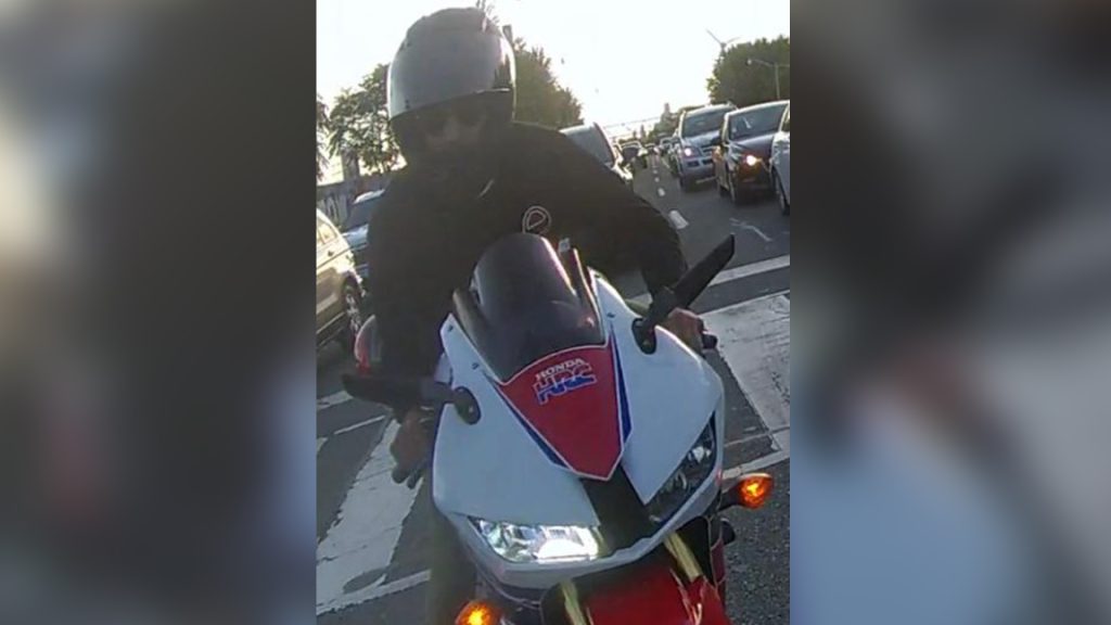 Photo of a motorcyclist wanted after allegedly striking a police officer that was directing traffic