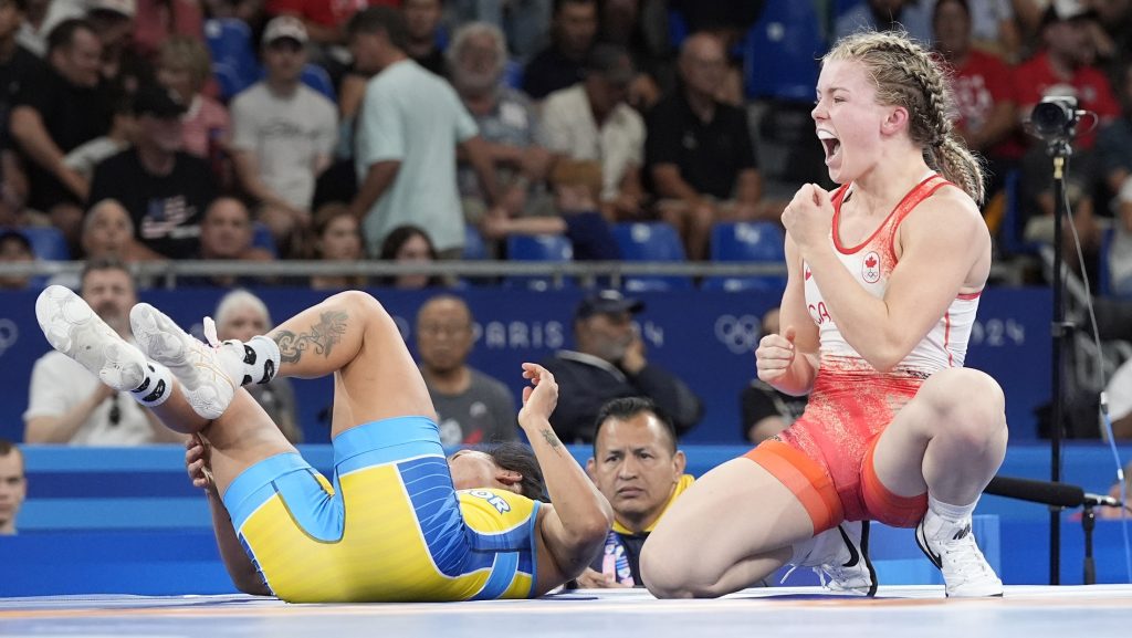 Canada's Hannah Fay Taylor celebrates after defeating Ecuador's Luisa Elizabeth Valverde Melendres during their women's freestyle 57kg repechage wrestling match at Champ-de-Mars Arena during the 2024 Summer Olympics in Paris, France, on Aug. 9, 2024