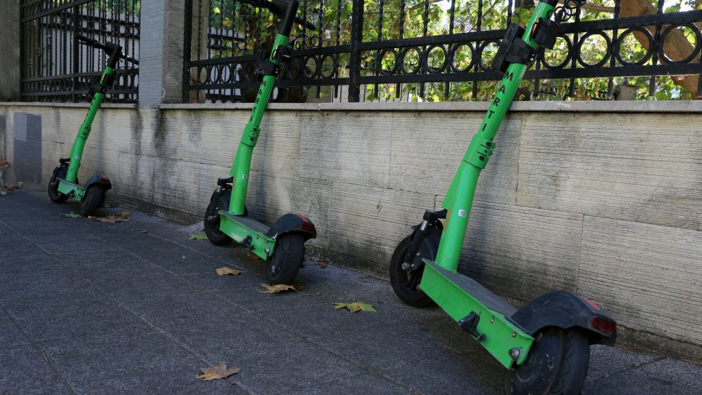 Several e-scooters are shown in this photo