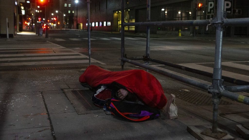 A man sleeps on the street in Toronto