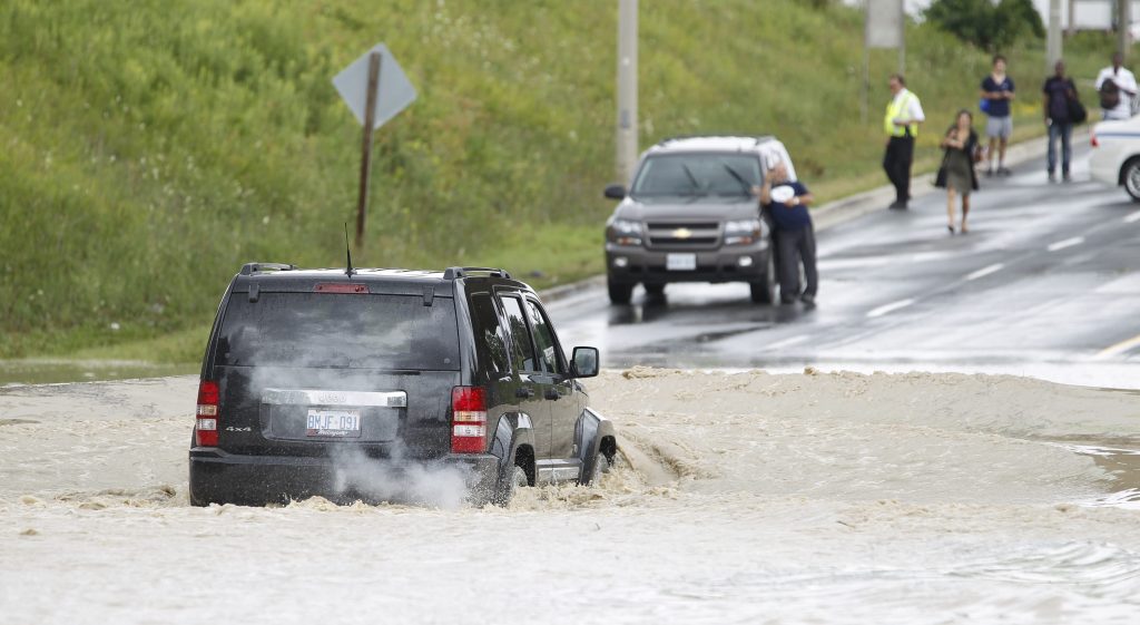 'Don't panic': What to do if your car gets stuck during a flash flood