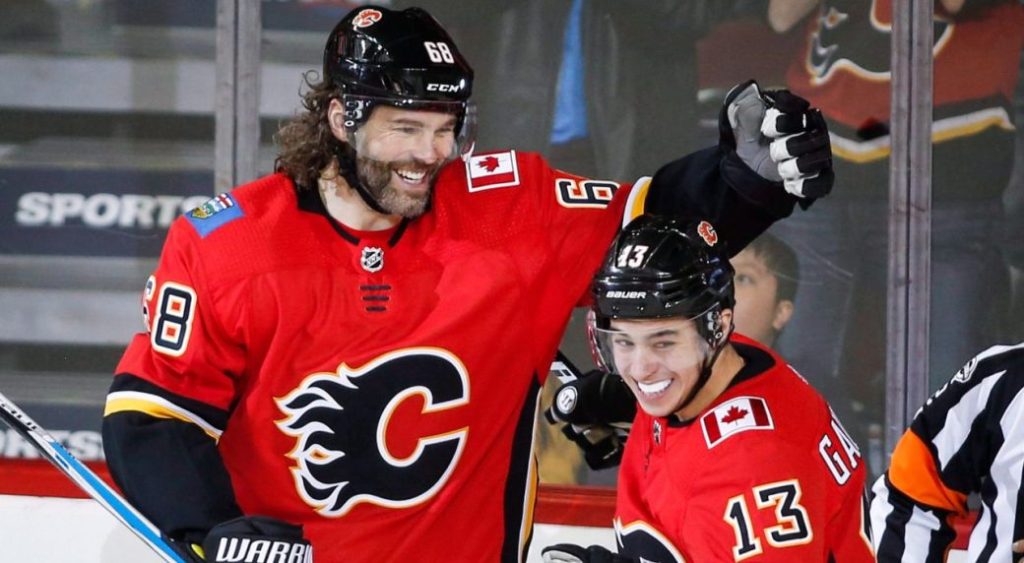 Calgary Flames' Jaromir Jagr celebrates his first goal as a Calgary Flame with teammate Johnny Gaudreau during second period NHL hockey action against the Detroit Red Wings, in Calgary on Thursday, Nov. 9, 2017. (Jeff McIntosh/CP Photo)