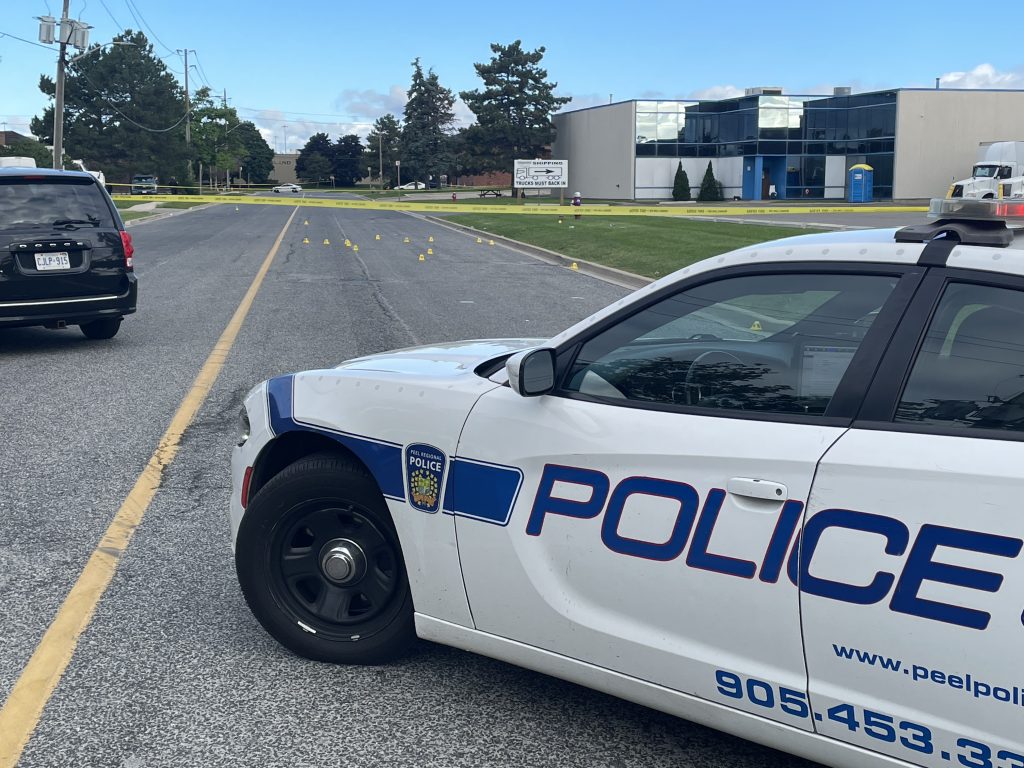 Police cruiser and markers in Mississauga after shooting, stabbing