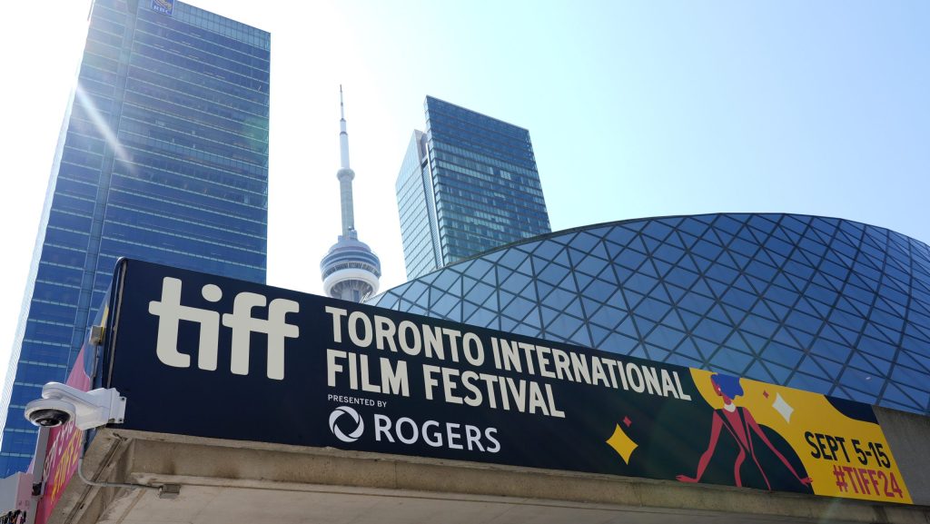 A sign for the 2024 Toronto International Film Festival Festival is pictured in front of the CN Tower on the opening day of the festival in Toronto on Sept. 5, 2024