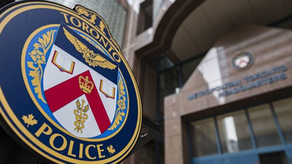 A Toronto Police Service emblem is seen outside police headquarters in Toronto