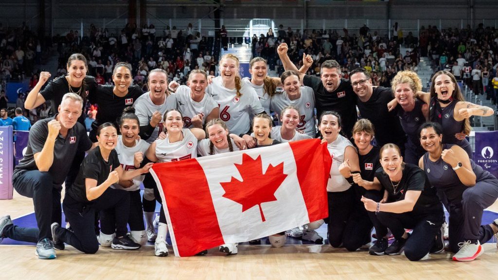 Canada celebrates the bronze medal win in women's sitting volleyball