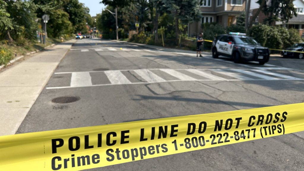 Toronto police investigate a shooting on Rosemount Avenue near Oakwood Avenue on Sept. 13, 2024