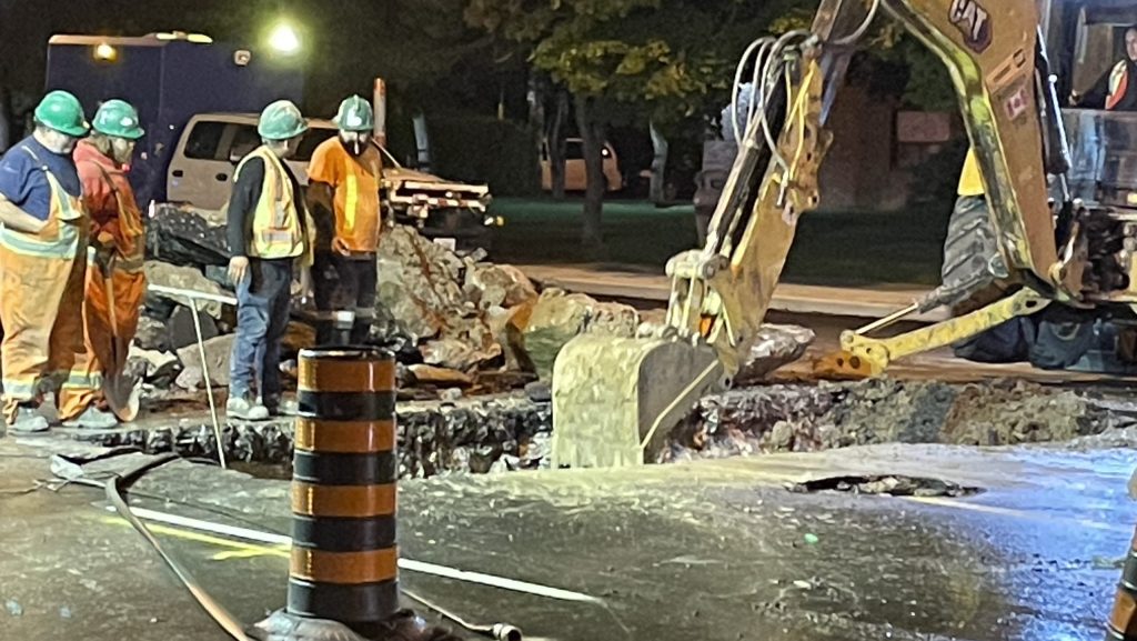 Crews work to repair the roadway following a watermain break on Lawrence Avenue East near Pharmacy Avenue on Sept. 13, 2024