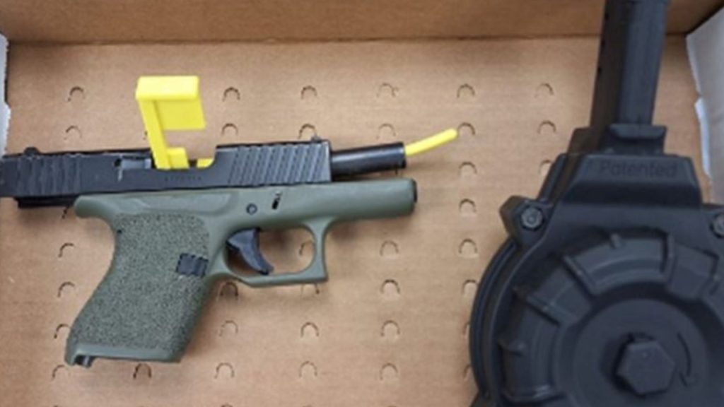 Police say they located and seized a 9 mm handgun with an overcapacity drum magazine