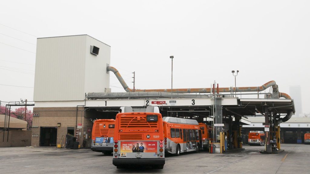 Buses enter a Los Angeles MTA bus depot near the site where overnight a bus was hijacked by an armed subject with passengers on board