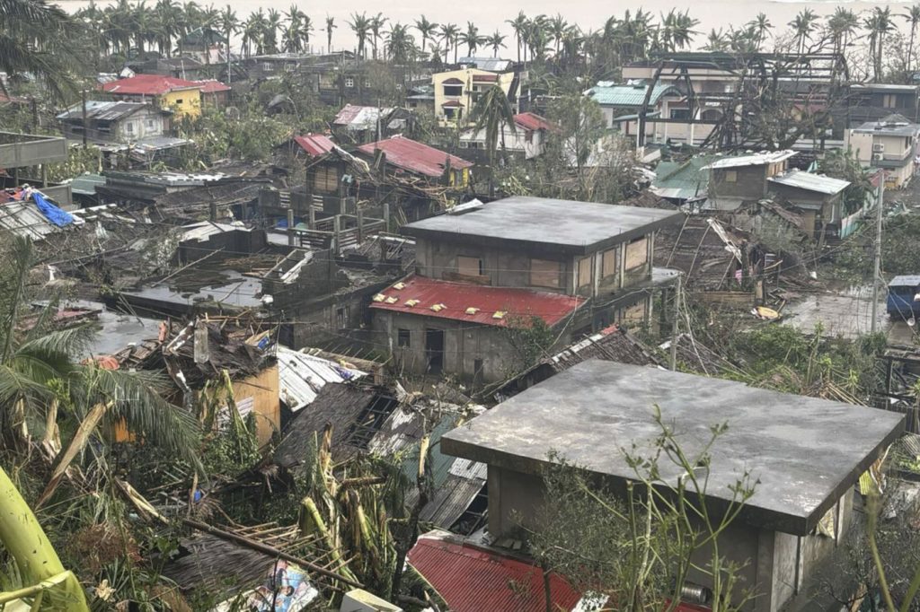 Latest typhoon batters the Philippines, causing tidal surges and displacing about 400,000 people