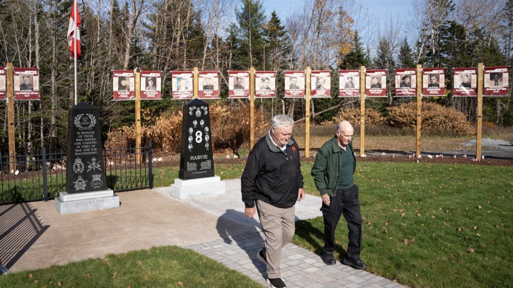 Cousins Victor Harvie, left, and Richard Harvie at a new memorial honouring the war service of their fathers and uncles in the small community of Noel, N.S., on Nov. 4, 2024