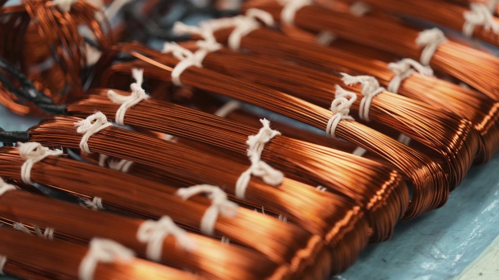 FILE - Bundles of copper cables sit at a plant that produces parts for large electric vehicles in Mexico City, on April 2, 2025. (AP Photo/Fernando Llano, File) 