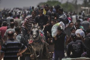 Palestinians say Israel and its allies fired on a crowd near Gaza aid site. Hospital says 14 killed