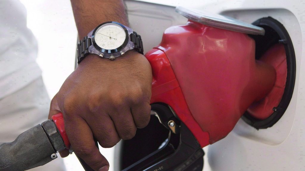 A person pumps fuel in Toronto. THE CANADIAN PRESS/Michelle Siu