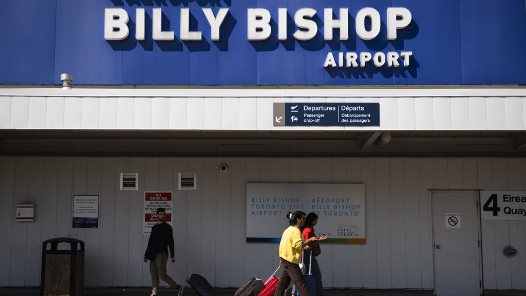People arrive at Billy Bishop Airport in Toronto on Friday, July 19, 2024. THE CANADIAN PRESS/Christopher Katsarov