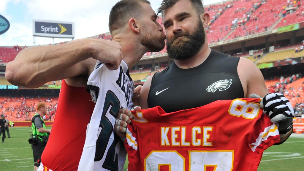 Chiefs tight end Travis Kelce, left, kisses his brother, Eagles center Jason Kelce, after they exchanged jerseys following the Chiefs’ win on Sept. 17, 2017.Ed Zurga / Associated Press.