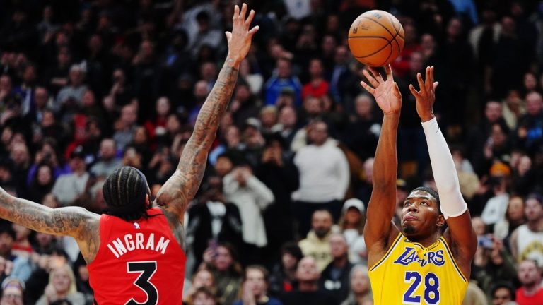 Los Angeles Lakers' Rui Hachimura (28) shoots the game-winning basket over Toronto Raptors' Brandon Ingram (3) during second half NBA basketball action in Toronto on Thursday, Dec. 4, 2025. THE CANADIAN PRESS/Frank Gunn