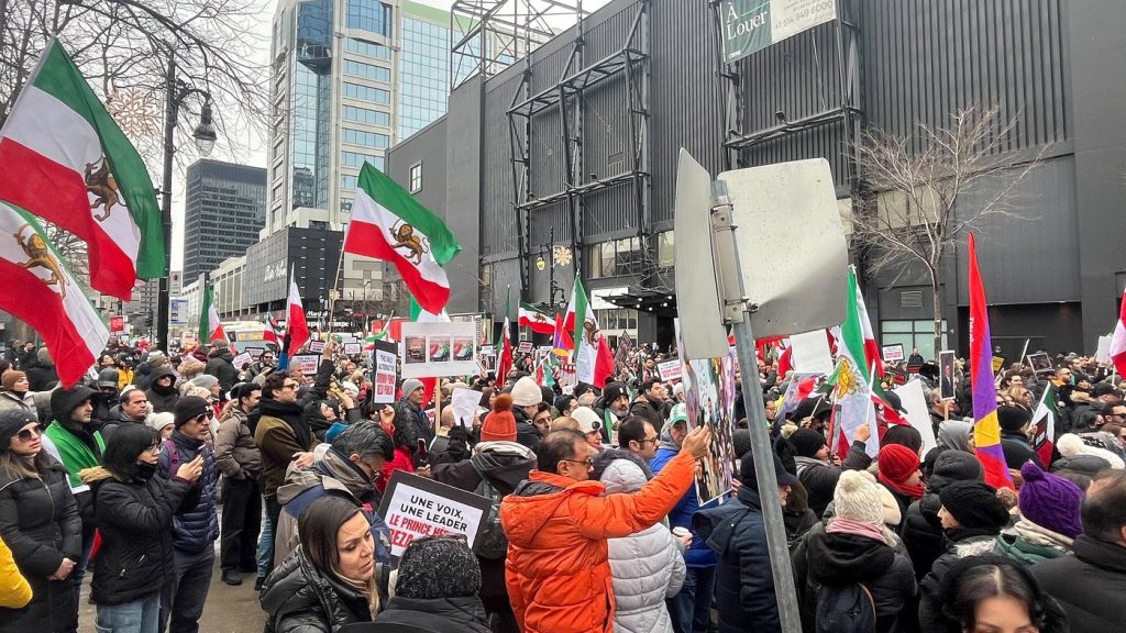 Attendees are seen during a rally to voice support for the Iranian people, in Montreal, Saturday, Jan. 10, 2026. A popular uprising sweeping across Iran neared the two-week mark Saturday. THE CANADIAN PRESS/Quentin Dufranne