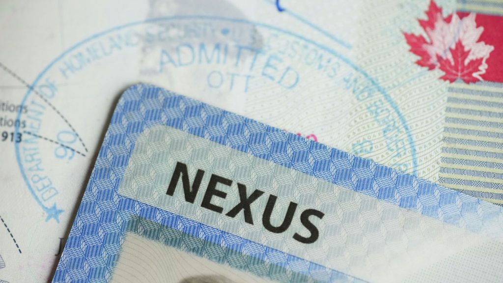 A NEXUS card and a Canadian passport are pictured in Ottawa, Tuesday, Jan. 17, 2023. THE CANADIAN PRESS/Sean Kilpatrick