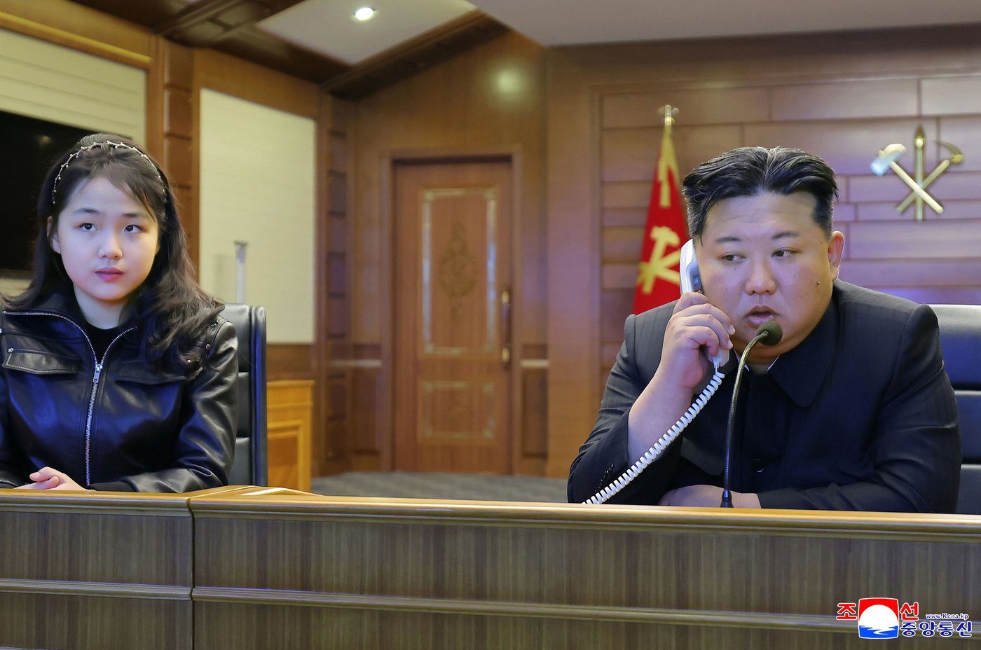 North Korean leader Kim and his daughter try out new pistols at shooting range