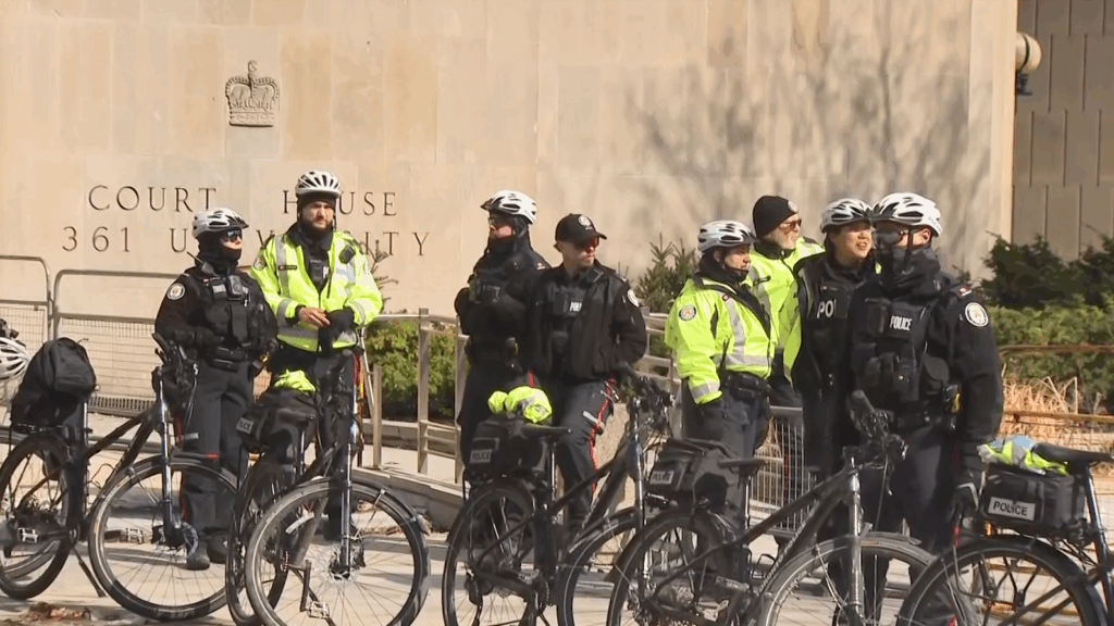 Photo shows Toronto police monitoring a protest on University Avenue on Sat. April 4, 2026. (CityNews)