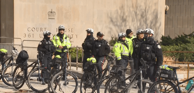 Photo shows Toronto police monitoring a protest on University Avenue on Sat. April 4, 2026. (CityNews)