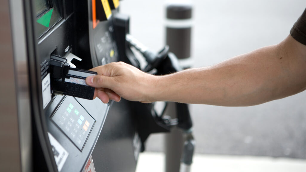 Man pays for gas at a gas station. Photo: iStock/Getty Images.
