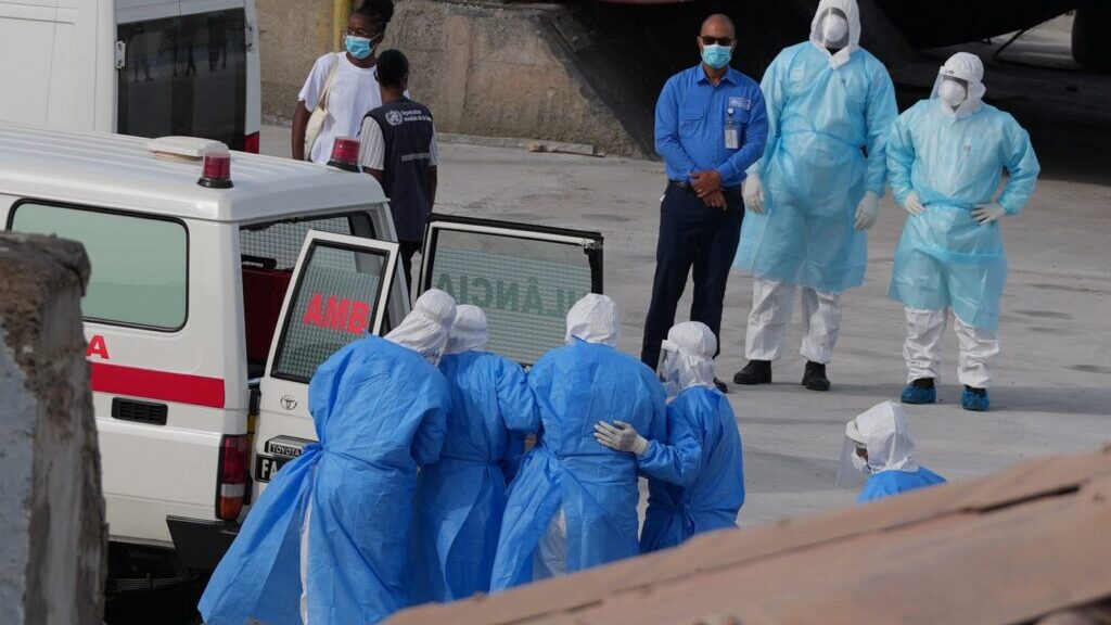 FILE - Health workers in protective gear evacuate patients from the MV Hondius cruise ship into an ambulance at a port in Praia, Cape Verde, May 6, 2026. (AP Photo/Misper Apawu, File)