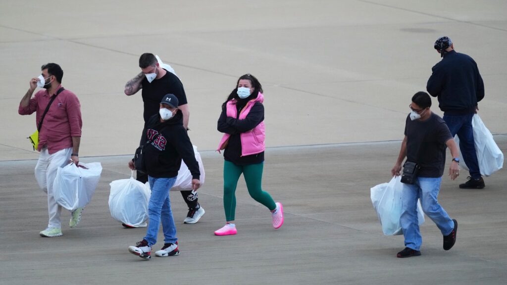 Passengers evacuated from the hantavirus-stricken cruise ship MV Hondius arrive at Eindhoven airport, Netherlands, Sunday, May 10, 2026. (AP Photo/Peter Dejong)