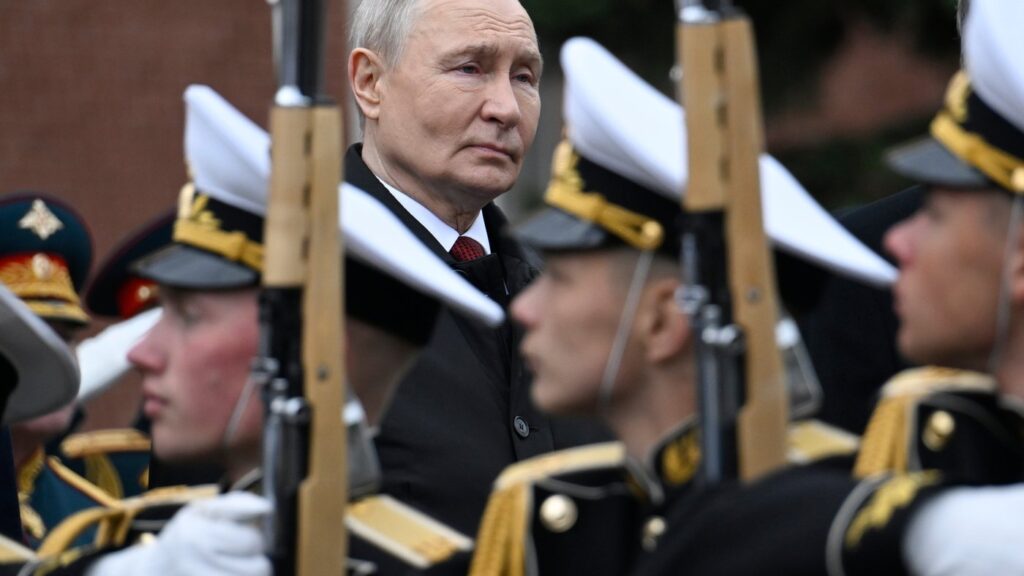 Russian President Vladimir Putin, centre foreground, attends a ceremony to lay flowers at the Tomb of the Unknown Soldier by the Kremlin wall inMoscow, Saturday, May 9, 2026, during celebrations of the 81st anniversary of the Soviet Union's victory over Nazi Germany during the World War II. (Alexander Nemenov/Pool Photo via AP)