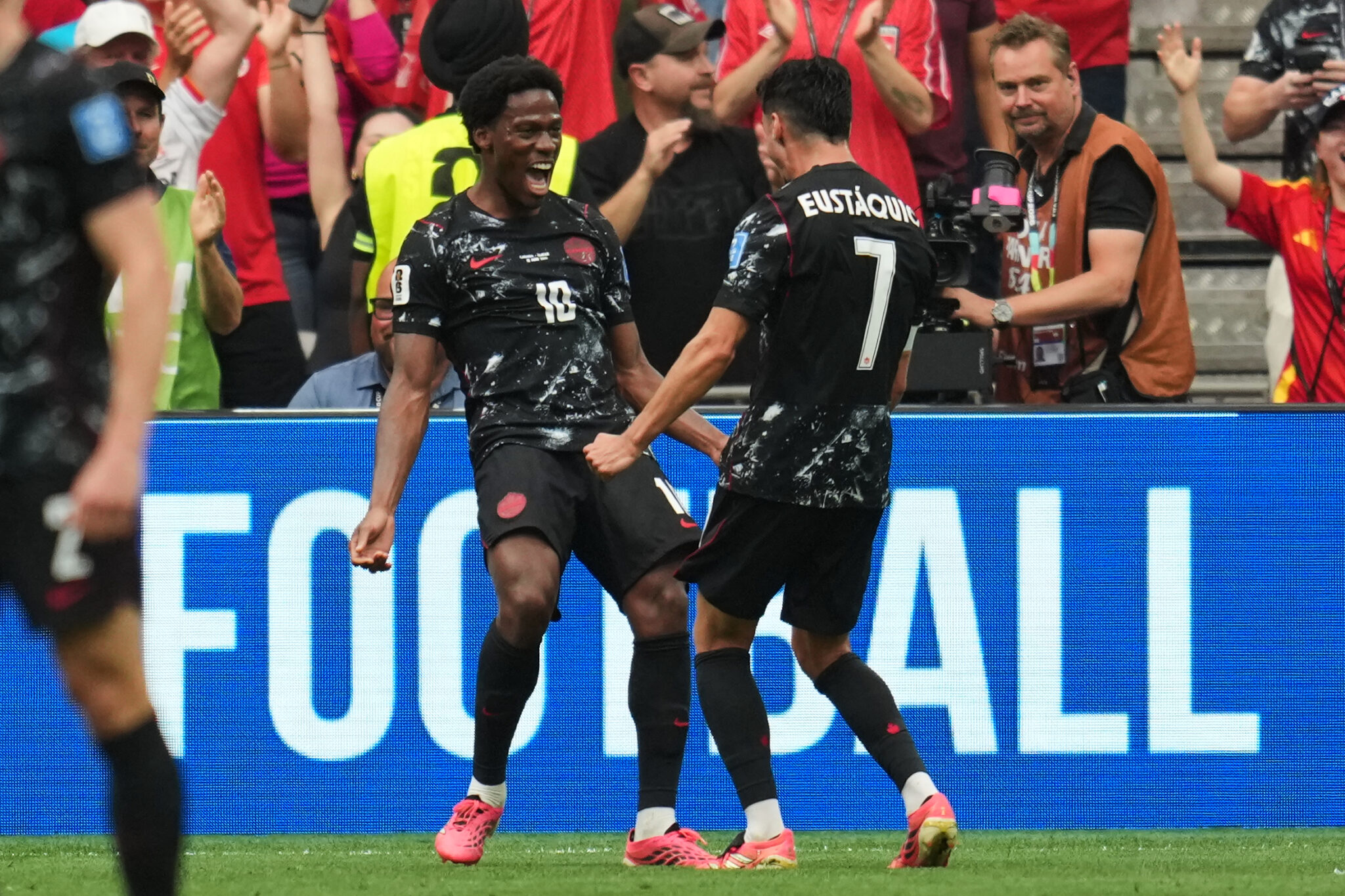Jonathan David of Canada, left, celebrates a goal with Steven Eustáquio after he helped score the third goal of his team during the group-stage match of the FIFA World Cup B group against Qatar in Vancouver, British Columbia, on Thursday, June 18, 2026. (AP Photo/Abbie Parr) Copyright 2026 The Associated Press. All rights reserved.