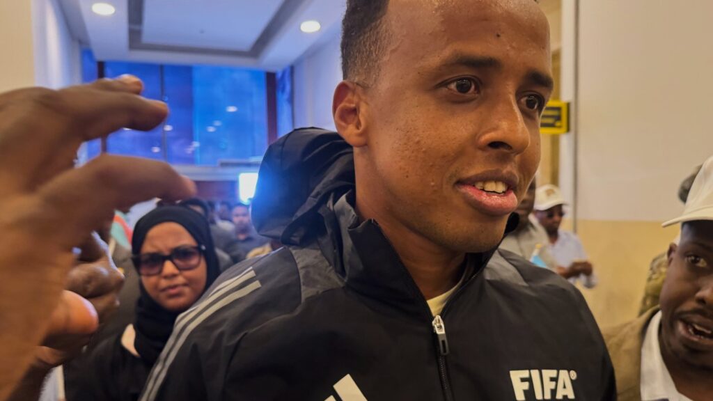 Referee Omar Artan, who was denied entry to the United States, arrives in Mogadishu, Somalia, Wednesday, June 10, 2026. (AP Photo/Farah Abdi Warsameh)