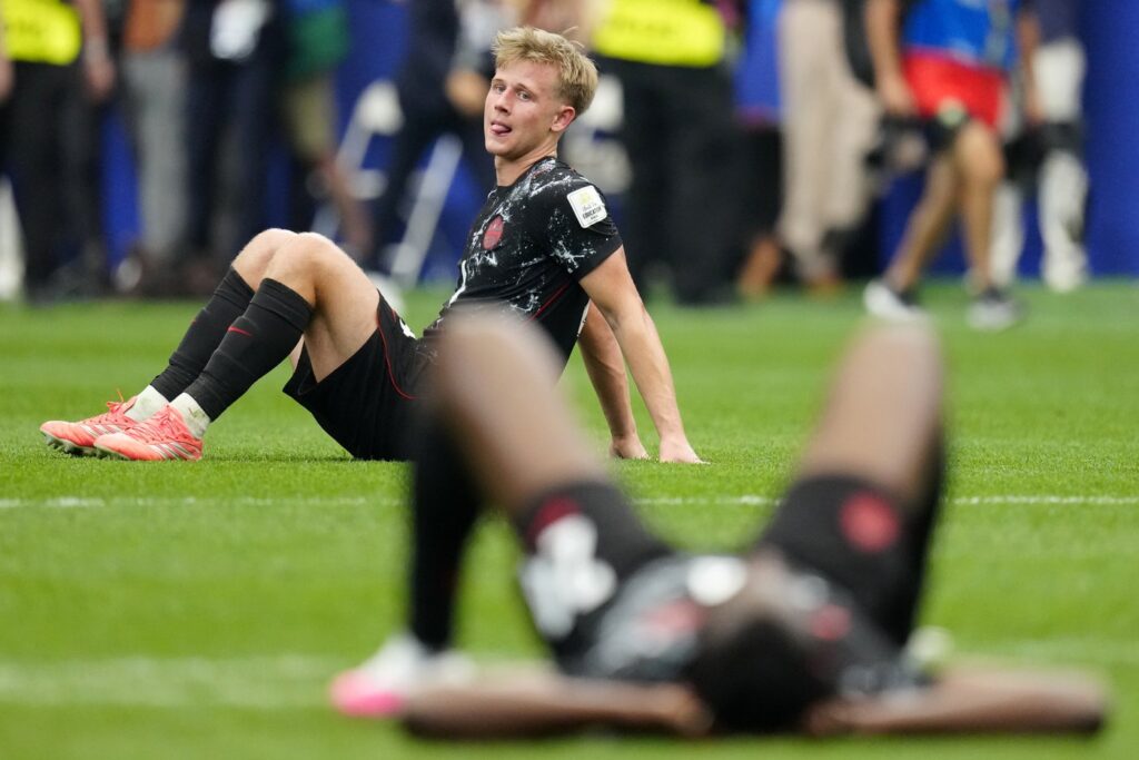 Canada's Luc de Fougerolles (4) sits on the turf following the team's loss to Morocco 